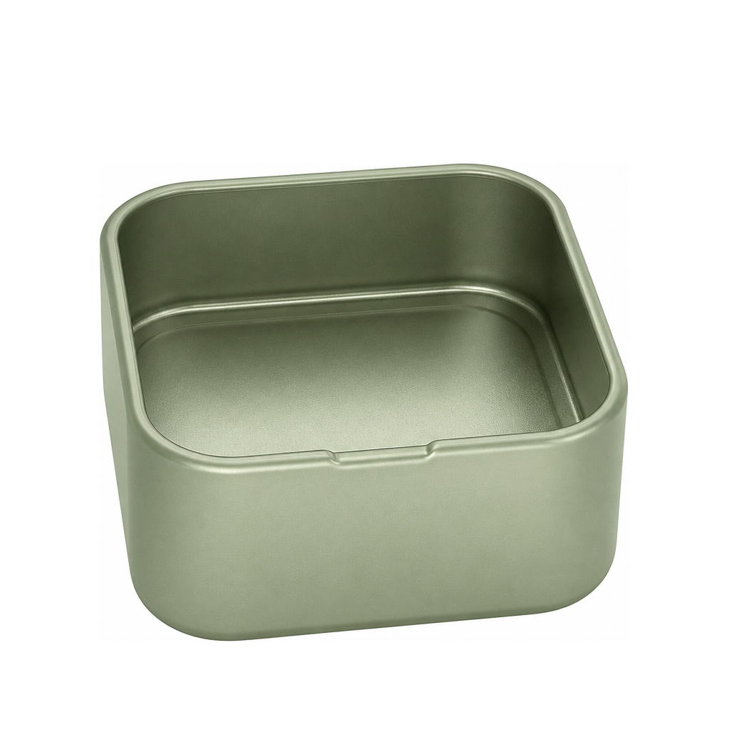 Pastel-colored embossed tins with open lids on a marble display