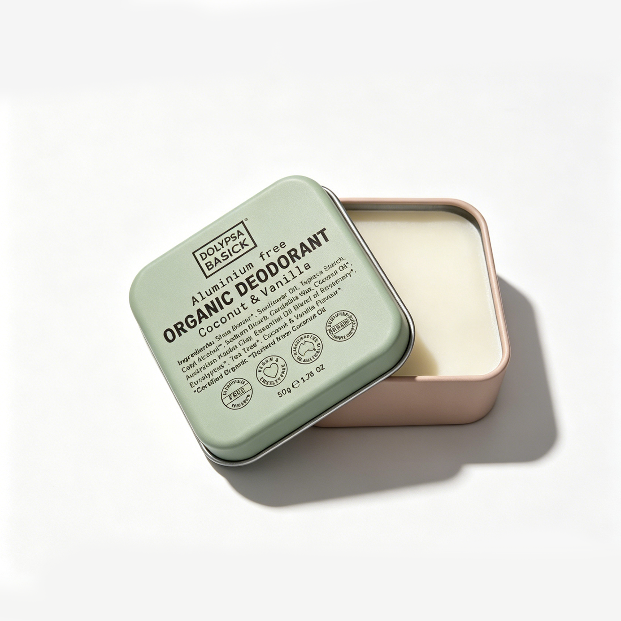 Square aluminum jar with green lid open to show creamy white organic deodorant