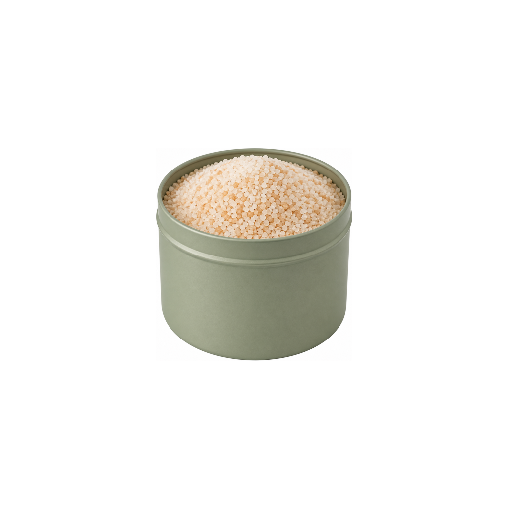 Green tin overflowing with pale pink bath salts